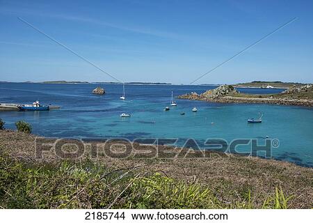 Distant View Of St Mary's From St Agnes, Isles Of Scilly, Cornwall, Uk, Europe View Large Photo Image Picture - Distant View Of St Mary's From St Agnes, Isles Of Scilly, Cornwall, Uk, Europe. Fotosearch
