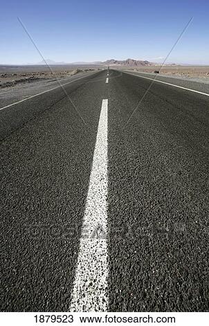 Stock Image - Dividing Line On Empty, Paved Road, Low Angle View. Fotosearch