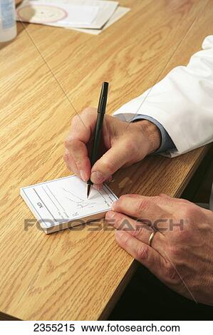 Doctor Writing Out A Prescription; Ottawa, Ontario, Canada View Large Photo Image Stock Photography - Doctor Writing Out A Prescription; Ottawa, Ontario, Canada. Fotosearch