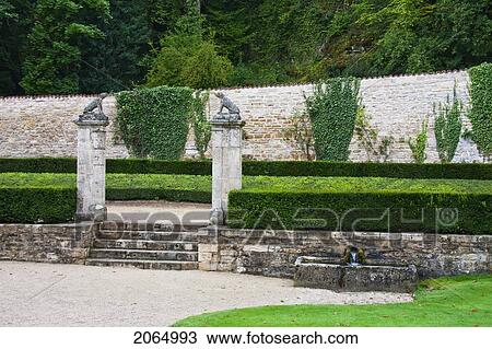 Stock Image - Dog Sculptures Atop A Gate In The Garden Of The Cistercian Abbey Of Fontenay, Cote D'or, France. Fotosearch