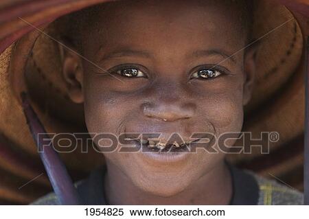Stock Photography - Dogon boy wearing a hat in Tireli, Mali. Fotosearch