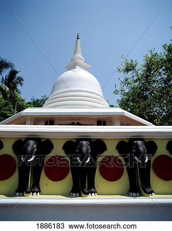 Stock Image - Dome Of Stupa And Elephant Heads At Sama Chaitya Temple. Fotosearch