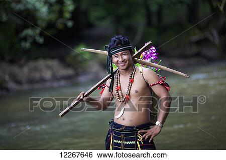 Domestic tourist dressed up as Bunong ethnic minority at Bou Sra Waterfall; Mondulkiri, Cambodia View Large Photo Image Stock Photograph - Domestic tourist dressed up as Bunong ethnic minority at Bou Sra Waterfall; Mondulkiri, Cambodia. Fotosearch