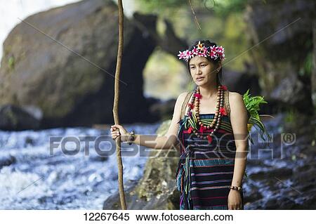 Domestic tourist dressed up as Bunong ethnic minority at Bou Sra Waterfall; Mondulkiri, Cambodia View Large Photo Image Stock Photography - Domestic tourist dressed up as Bunong ethnic minority at Bou Sra Waterfall; Mondulkiri, Cambodia. Fotosearch