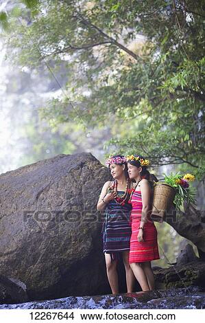 Domestic tourists dressing up as Bunong ethnic minority at Bou Sra Waterfall; Mondulkiri, Cambodia View Large Photo Image Picture - Domestic tourists dressing up as Bunong ethnic minority at Bou Sra Waterfall; Mondulkiri, Cambodia. Fotosearch