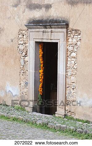 Stock Image - Door Decorated With Marigolds For The D. Fotosearch