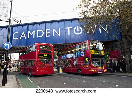 Double Decker Buses Passing Under The Bridge In Camden Town, North London, Lonoon, Uk View Large Photo Image Stock Image - Double Decker Buses Passing Under The Bridge In Camden Town, North London, Lonoon, Uk. Fotosearch