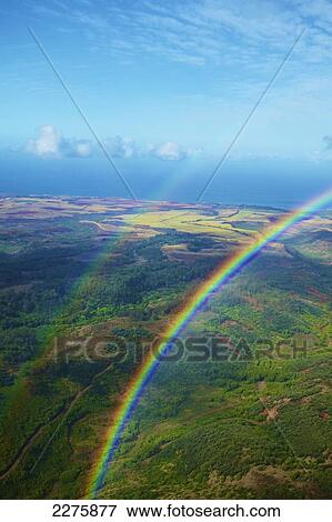 Double rainbow above a landscape of a hawaiian island, Na Pali coast; Kauai, Hawaii, United States of America View Large Photo Image Stock Photo - Double rainbow above a landscape of a hawaiian island, Na Pali coast; Kauai, Hawaii, United States of America. Fotosearch