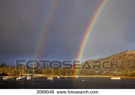 Double Rainbow Over The Harbour Of Windermere Lake; Cumbria England View Large Photo Image Stock Photo - Double Rainbow Over The Harbour Of Windermere Lake; Cumbria England. Fotosearch