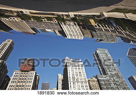 Stock Image - Downtown Buildings Reflecting In 'cloud Gate' (The Bean) Sculpture. Fotosearch