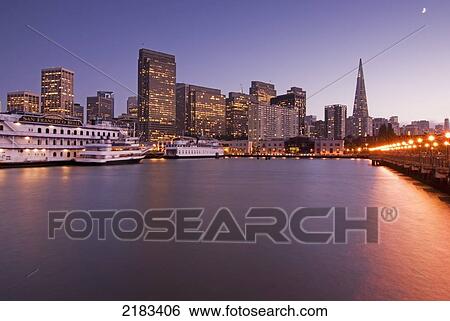 Downtown San Francisco And Water At Sunset Seen From The End Of A Pier; San Francisco California United States Of America View Large Photo Image Stock Photograph - Downtown San Francisco And Water At Sunset Seen From The End Of A Pier; San Francisco California United States Of America. Fotosearch