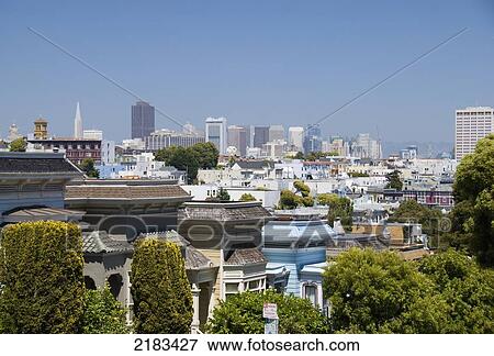 Downtown San Francisco With Victorian Houses In Front; San Francisco California United States Of America View Large Photo Image Stock Photo - Downtown San Francisco With Victorian Houses In Front; San Francisco California United States Of America. Fotosearch