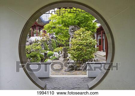 Stock Image - Dr. Sun Yat-Sen Park, As Seen From A Wall In Dr. Sun Yat-Sen Classical Chinese Garden In Chinatown, Vancouver, British Columbia, Canada. Fotosearch