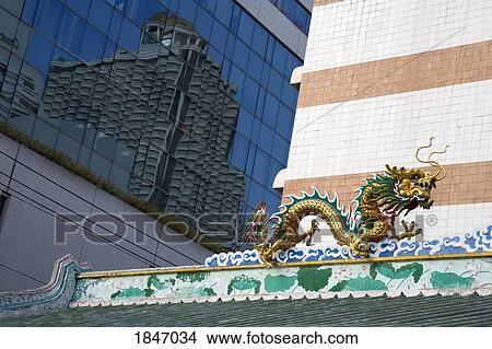 Dragon On Roof Of Chinese Temple Near Saphan Taksin Skytrain Station; Bangkok, Thailand View Large Photo Image Picture - Dragon On Roof Of Chinese Temple Near Saphan Taksin Skytrain Station; Bangkok, Thailand. Fotosearch