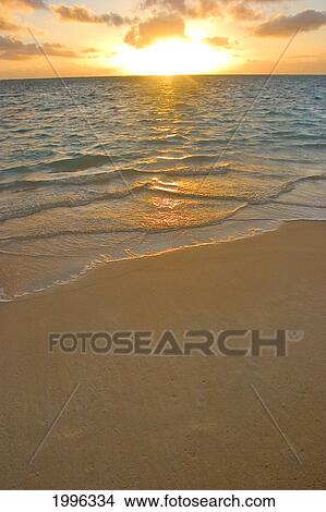 Dramatic Golden Sunrise And Ocean On Tropical Beach View Large Photo Image Picture - Dramatic Golden Sunrise And Ocean On Tropical Beach. Fotosearch