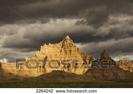 Dramatic light during a storm in badlands national park; south dakota usa View Large Photo Image Stock Image - Dramatic light during a storm in badlands national park; south dakota usa. Fotosearch