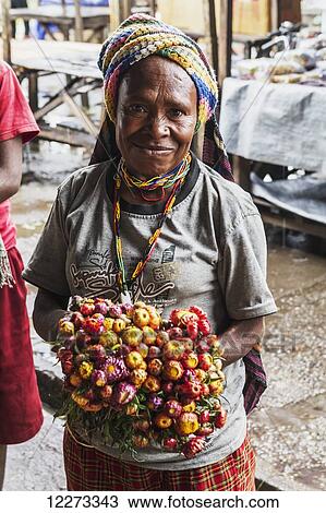 Dried flower vendor at the market, Wamena, Papua, Indonesia View Large Photo Image Stock Image - Dried flower vendor at the market, Wamena, Papua, Indonesia. Fotosearch