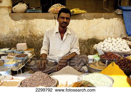 Stock Image - Dried produce stall holder, Chaudi Market, Chaudi, Goa, India.. Fotosearch