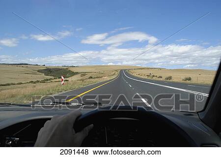 Stock Photo - Driving Along Empty Roads Through Rolling Hills Of South Africa Between Cape Town And The Garden Route.. Fotosearch