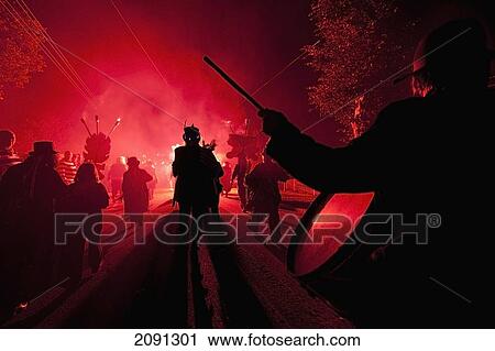 Stock Image - Drummers Marching Through The Centre Of Staplecross Village At The Ewhurst And Staplecross Bonfire Society Night, East Sussex, Uk. Fotosearch