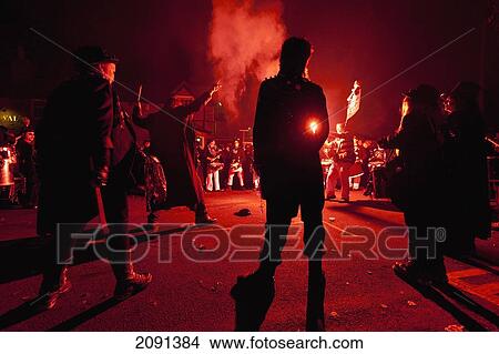 Picture - Drumming Band In Circle Lit By Red Flare In Front Of The Pub, Barcombe Bonfire Night, East Sussex, Uk. Fotosearch