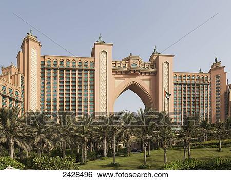 Stock Photograph - Dubai Atlantis Hotel Palm with palm trees and blue sky; Dubai, United Arab Emirates. Fotosearch