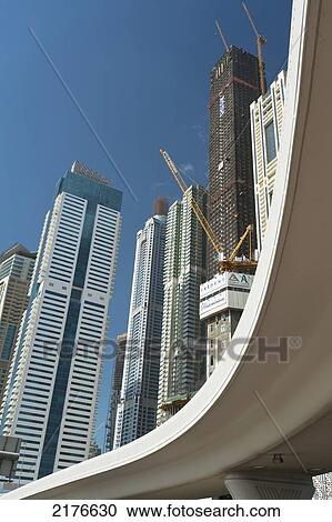 Dubai Marina, Dubai, Uaeroad Bridge In Front Of Tall Residential And Office Blocks In Dubai Marina View Large Photo Image Stock Image - Dubai Marina, Dubai, Uaeroad Bridge In Front Of Tall Residential And Office Blocks In Dubai Marina. Fotosearch