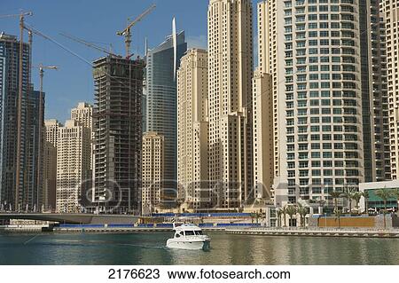Dubai, Uaeboat In Dubai Marina In Front Of Large Residential Blocks Of Flats View Large Photo Image Stock Image - Dubai, Uaeboat In Dubai Marina In Front Of Large Residential Blocks Of Flats. Fotosearch