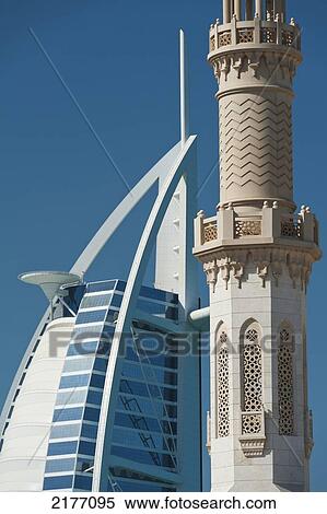 Dubai, Uaedetail Of Minaret Of Small Mosque In Front Of The Burj Al Arab Hotel View Large Photo Image Stock Photography - Dubai, Uaedetail Of Minaret Of Small Mosque In Front Of The Burj Al Arab Hotel. Fotosearch