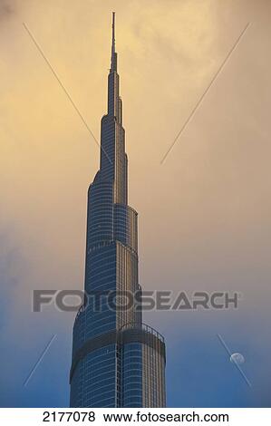 Stock Photo - Dubai, Uaedetail Of The Burj Khalifa With Moon Rising Behind. Fotosearch