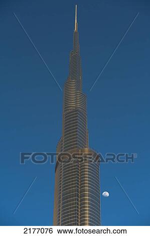 Stock Photograph - Dubai, Uaedetail Of The Burj Khalifa With Moon Rising Behind. Fotosearch