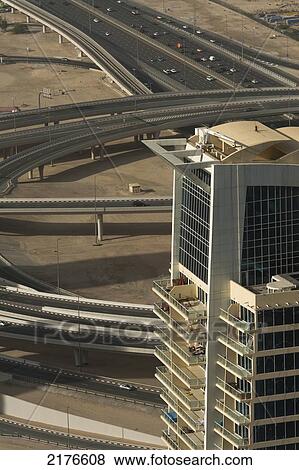 Stock Photo - Dubai, Uaeresidential Block Of Flats In Front Of Large Road Junction. Fotosearch