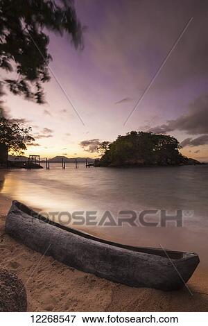 Dugout canoe on small beach on Mumbo Island, Lake Malawi; Malawi View Large Photo Image Stock Photo - Dugout canoe on small beach on Mumbo Island, Lake Malawi; Malawi. Fotosearch