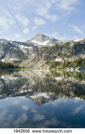 Stock Photograph - Eagle Cap Peak, Mirror Lake, Eagle Cap Wilderness, Oregon, Usa; Mountain Peak Reflected In Lake. Fotosearch