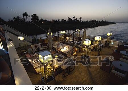 Stock Image - Early evening drink aboard nile cruise boat near luxor; west bank luxor upper egypt. Fotosearch