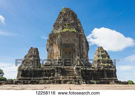 Stock Photograph - East Mebon Temple dedicated to Hindu god Shiva, built by the king Rajendravarman VII in tenth century, from Angkor; Siem Reap, Cambodia. Fotosearch