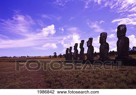 Stock Image - Easter Island, Ahu Akivi Platform With Line Of Moai Statues, Purple Sky.. Fotosearch