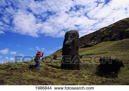 Easter Island, Rano Raraku Area, Man Taking Picture Of Moai Statues. View Large Photo Image Picture - Easter Island, Rano Raraku Area, Man Taking Picture Of Moai Statues.. Fotosearch