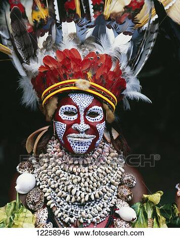 Stock Photograph - Eastern Highlander in traditional bilas; Eastern Highlands, Papua New Guinea. Fotosearch