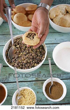 Stock Image - Eating a meal at Baghvan Wilderness Lodge, Pench National Park; Madhya Pradesh, India. Fotosearch