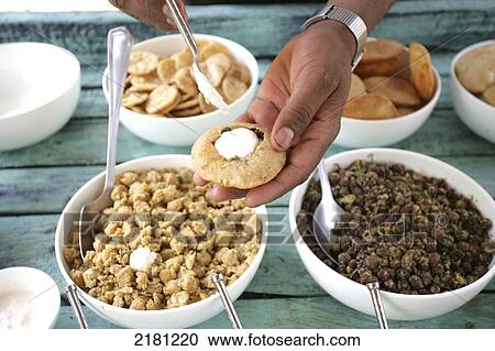 Stock Image - Eating a meal at Baghvan Wilderness Lodge, Pench National Park; Madhya Pradesh, India. Fotosearch