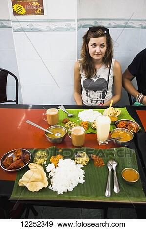 Eating Indian food at a local restaurant in the Georgetown Little India area; Penang, Malaysia View Large Photo Image Stock Photo - Eating Indian food at a local restaurant in the Georgetown Little India area; Penang, Malaysia. Fotosearch