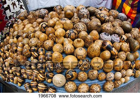 Stock Photo - Ecuador, Otavalo, Famous Outdoor Indian Market, Hand-Carved Gourds For Sale, Wide Angle.. Fotosearch