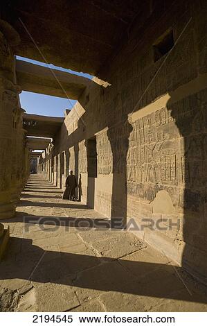 Egypt, Aswan, Temple of Isis; Philae Island, Temple guard walking along West Colonnade View Large Photo Image Stock Photography - Egypt, Aswan, Temple of Isis; Philae Island, Temple guard walking along West Colonnade. Fotosearch
