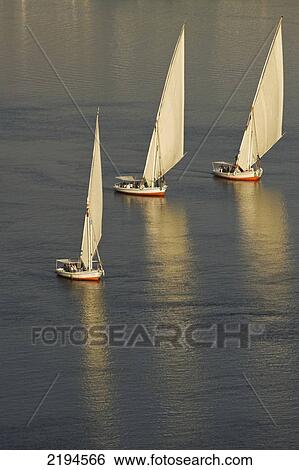 Stock Photograph - Egypt, Felucca on River Nile at dusk; Aswan. Fotosearch