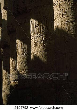 Stock Image - Egypt, Luxor, Precinct of Amun; Karnak, Hieroglyphs on columned hallway of Great Hypostyle Hall. Fotosearch