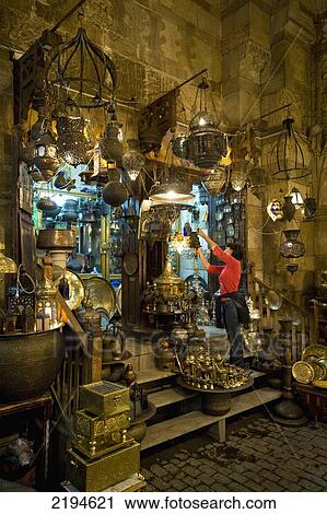 Egypt, Woman shopping at night at stalls in covered gateway in Khan El Khalili; Cairo View Large Photo Image Stock Image - Egypt, Woman shopping at night at stalls in covered gateway in Khan El Khalili; Cairo. Fotosearch
