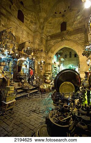 Egypt, Woman shopping at night at stalls in covered gateway in Khan El Khalili; Cairo View Large Photo Image Stock Photography - Egypt, Woman shopping at night at stalls in covered gateway in Khan El Khalili; Cairo. Fotosearch