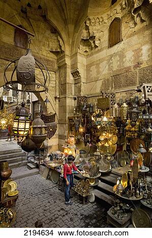 Egypt, Woman shopping at stalls in covered gateway in Khan El Khalili; Cairo View Large Photo Image Picture - Egypt, Woman shopping at stalls in covered gateway in Khan El Khalili; Cairo. Fotosearch
