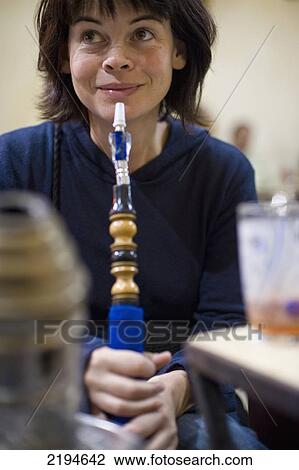 Egypt, Woman smoking sheesha pipe in cafe; Cairo View Large Photo Image Stock Image - Egypt, Woman smoking sheesha pipe in cafe; Cairo. Fotosearch